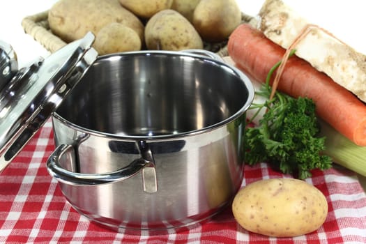 pot and fresh ingredients for a potato soup