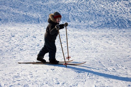 Winter snow ski sport - little child fun skiing