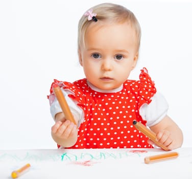 Portraite clouse-up of little sweet girl draws with crayons in red, isolated on white