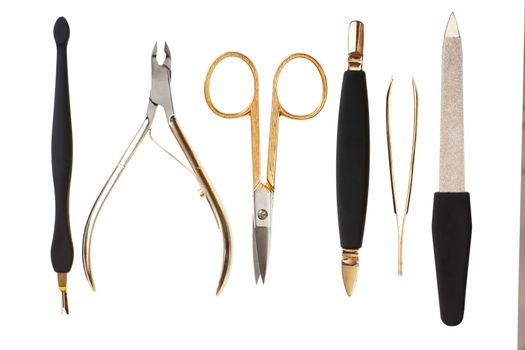 A set of metallic manicure tools.