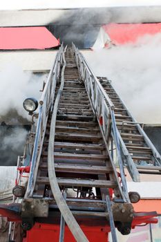 Burning fire smoke firefighter emergency ladder