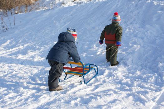 Little child fun winter outdoor snow sport sled