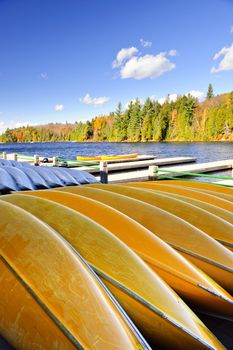 Canoes for rent on fall lake in Algonquin Park, Ontario, Canada