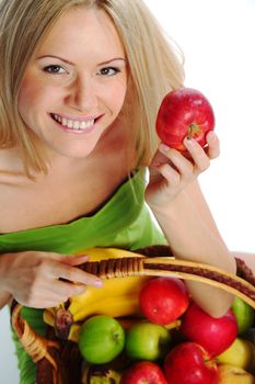 woman holds a basket of fruit on a white background