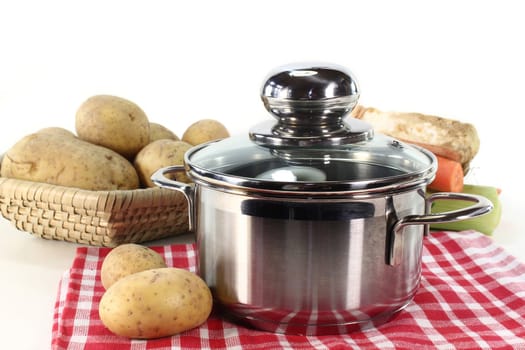 pot and fresh ingredients for a potato soup