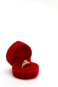 isolated female diamond ring in red valvet box