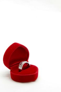 isolated male diamond ring in red valvet box