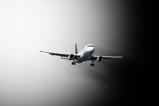 Passenger plane flies - abstract black and white composition