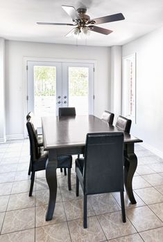 Room with dining table and chairs in upscale home