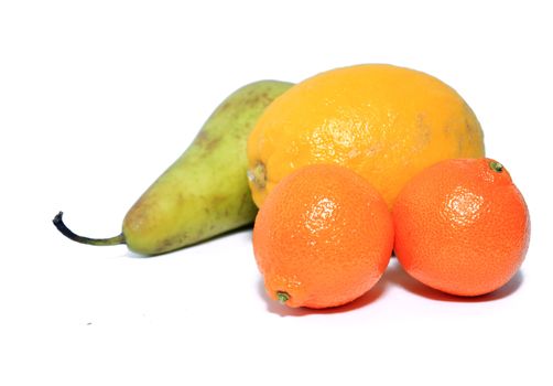 pear, tangerine and lemon on white background