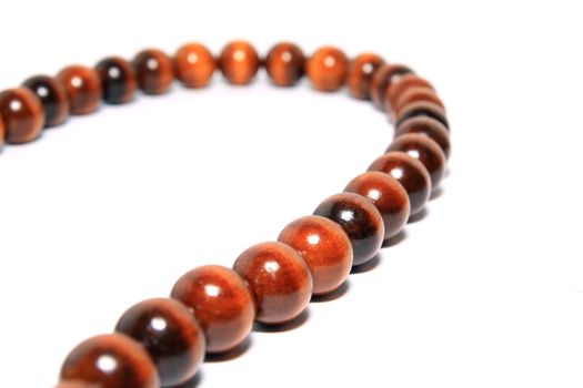 wooden necklace on white background