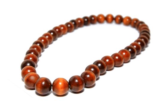 wooden necklace on white background