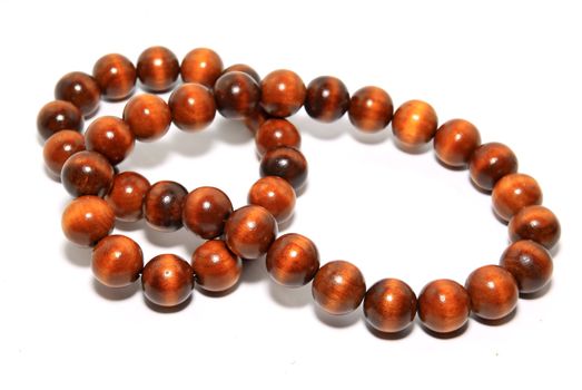 wooden necklace on white background