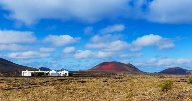 Panorama of a typical cottage, built on the lava of the volcano. Lanzarote, Canary Islands