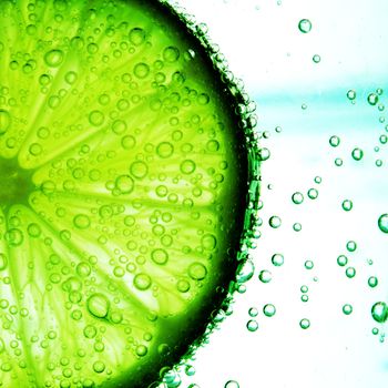 lime slice in water bubbles