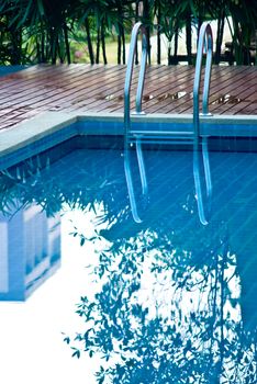 Swimming pool with reflected on water surface