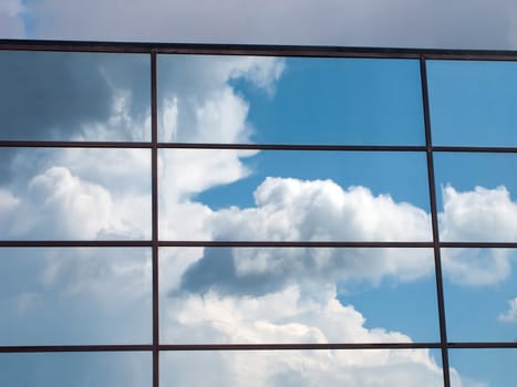 Blue sky and cloud reflection in building outdoors