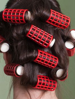 Curlers hair roller on adult beauty women