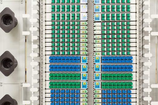 fiber optic cable management system with green and blue SC connectors