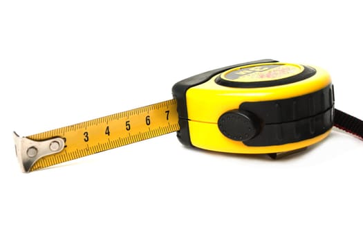 Measuring tool yellow tape measure white isolated