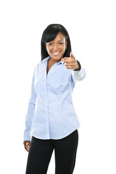 Smiling black woman pointing finger at camera isolated on white background