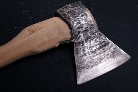 Sharp metal hatchet or axe wood cutting work tool