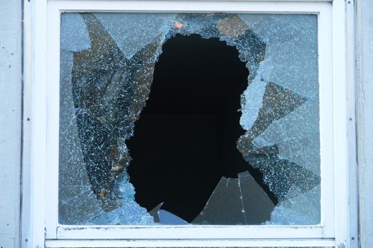 Broken Window with very sharp glass fragments