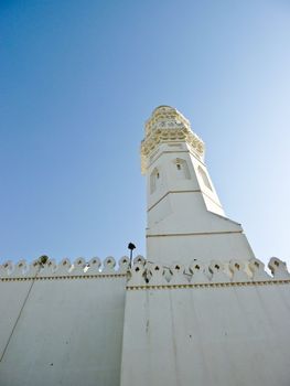 the minaret of Quba' mosque in the bright morning dessert sun in Medina