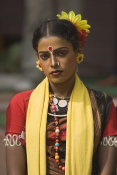 Indian dancer in traditional tribal outfit at the Sarujkund Craft Fair in Haryana near Delhi, India.