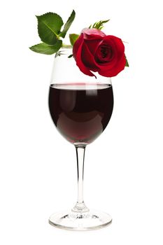 Romantic  rose on top of  red wine glass isolated on white background