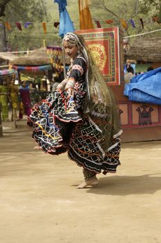 Tribal dancer performing at the Sarujkund Fair near Delhi, India