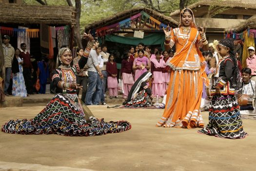 Female tribal dancers performing at the Sarujkund Fair near Delhi, India.