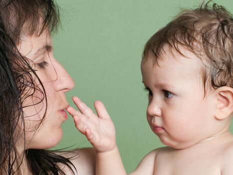 Smiling mother and little child - family happiness