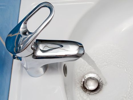 Clean sink and faucet at home toilet or bathroom