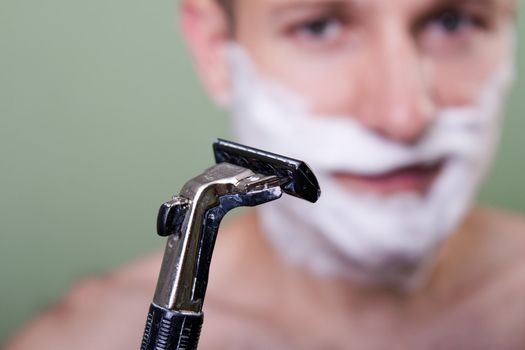 Beauty men with razor shaving blade cutting hair