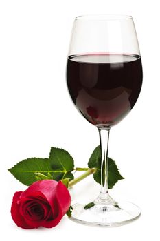 Romantic glass of red wine with long stemmed rose isolated on white background