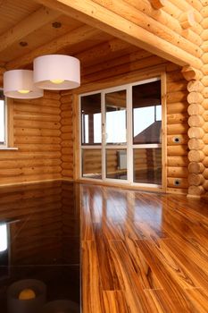 Spacious hall in the wooden house, executed in style hight-tech