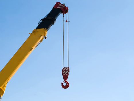 Building crane boom with steel hook