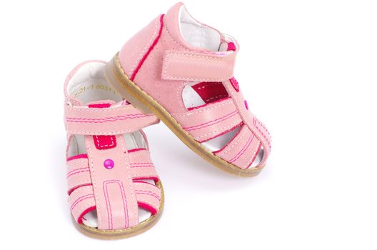 pink child's sandals isolated on white