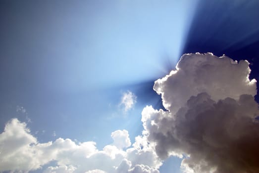 blue sky with clouds and sun