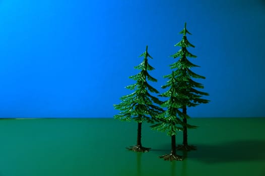 Trees on a dark blue and green background