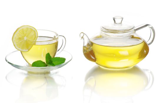 Tea being poured into glass tea cup