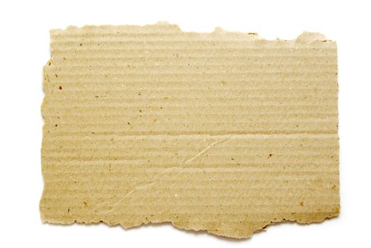 Ripped piece of cardboard on white