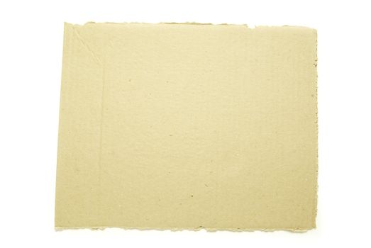Ripped piece of cardboard on white