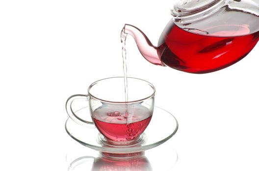 Tea being poured into glass tea cup