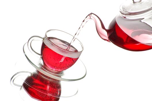 Tea being poured into glass tea cup
