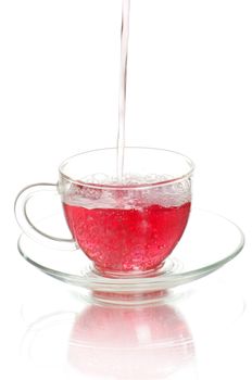 tea being poured into glass tea cup