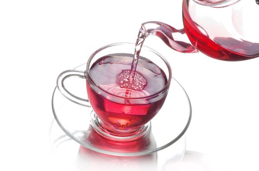 Tea being poured into glass tea cup