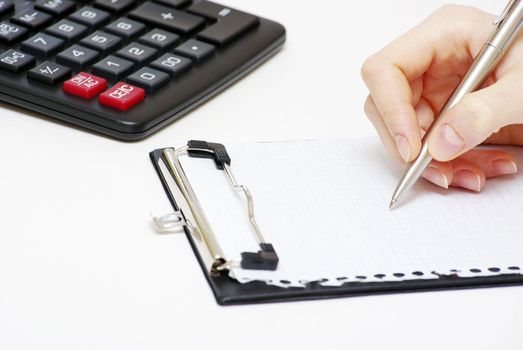 Business concept with pen and calculator