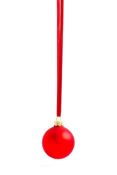 Christmas ball hanging with ribbons on white background